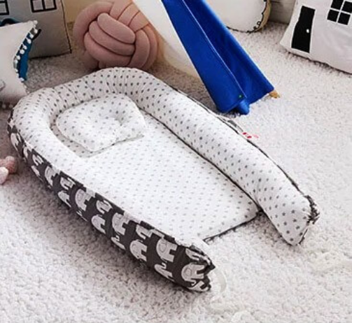 Réducteur de lit bébé | cocon bébé royaumedebebeetmaman.com.com