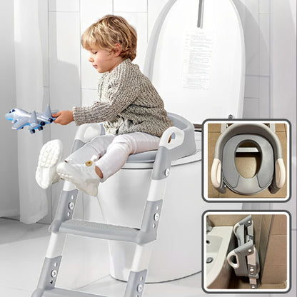 bebe_sur_reducteur_toilette_gris